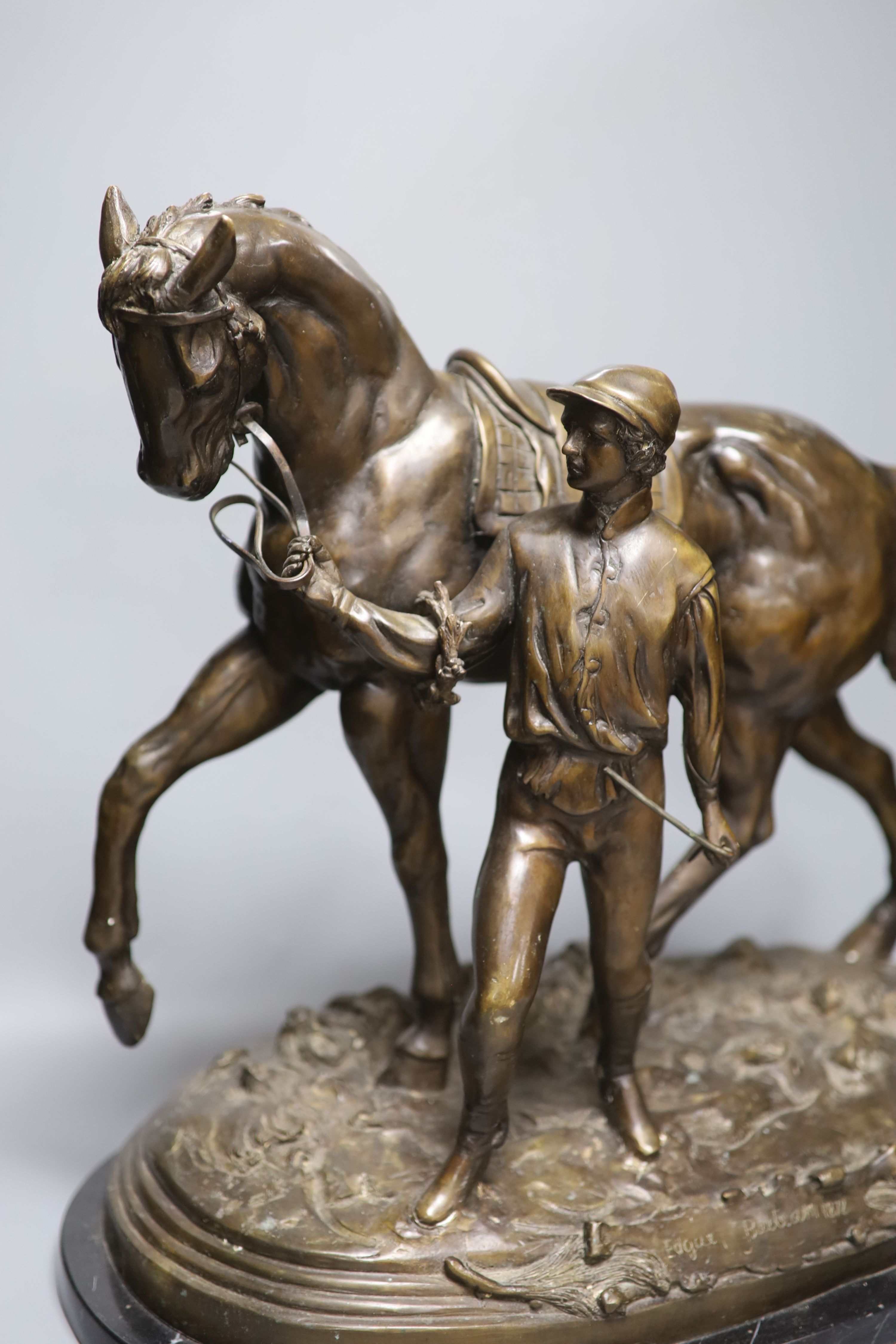 After Edgar Beetram. A large bronze horse and jockey, signed 1872, length 52cm